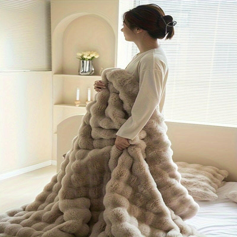 High-end bedding setup with soft comforter and pillows styled in a cozy bedroom