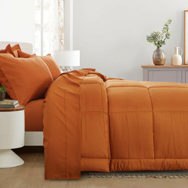 Minimalist bedroom with modern bedding set, featuring soft sheets and accent cushions